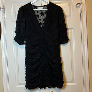 Black party dress with star appliqué all over